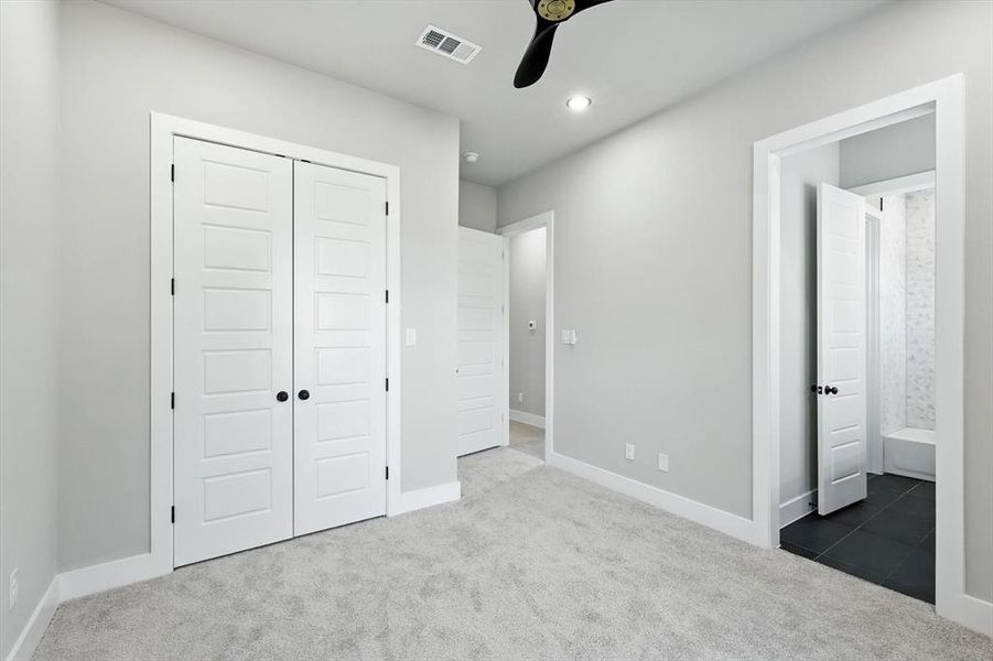 Unfurnished bedroom featuring carpet, ensuite bath, a closet, recessed lighting, and a ceiling fan Unfurnished bedroom featuring carpet, ensuite bath, a closet, recessed lighting, and a ceiling fan
