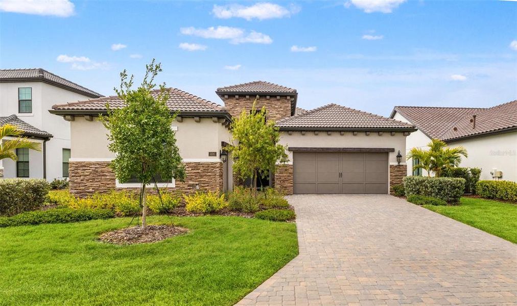 Front exterior of a new home in , Nokomis, FL, highlighting curb appeal (Image 24). Front exterior of a new home in , Nokomis, FL, highlighting curb appeal (Image 24).