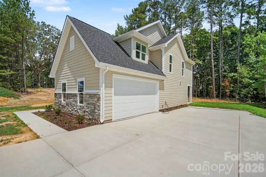 Front exterior of a new home in , Locust, NC, highlighting curb appeal (Image 2). Front exterior of a new home in , Locust, NC, highlighting curb appeal (Image 2).