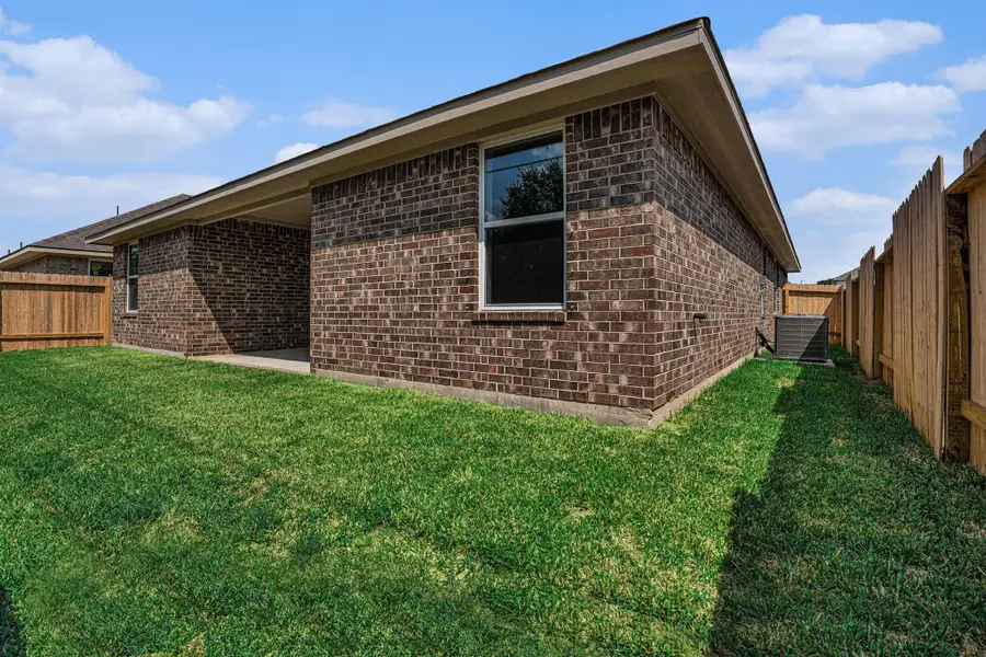 Front exterior of a new home in Kiber Reserve, Angleton, TX, highlighting curb appeal (Image 2).