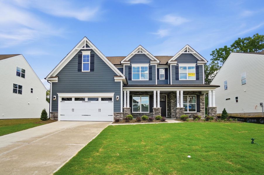 Front exterior of a new home in Harmony, Harrisburg, NC, highlighting curb appeal (Image 1). Front exterior of a new home in Harmony, Harrisburg, NC, highlighting curb appeal (Image 1).