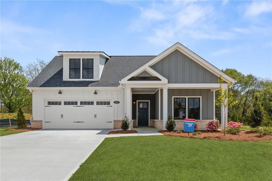 Front exterior of a home in the The Courtyards of Franklin Goldmine community, located in Cumming, GA (Image 16).