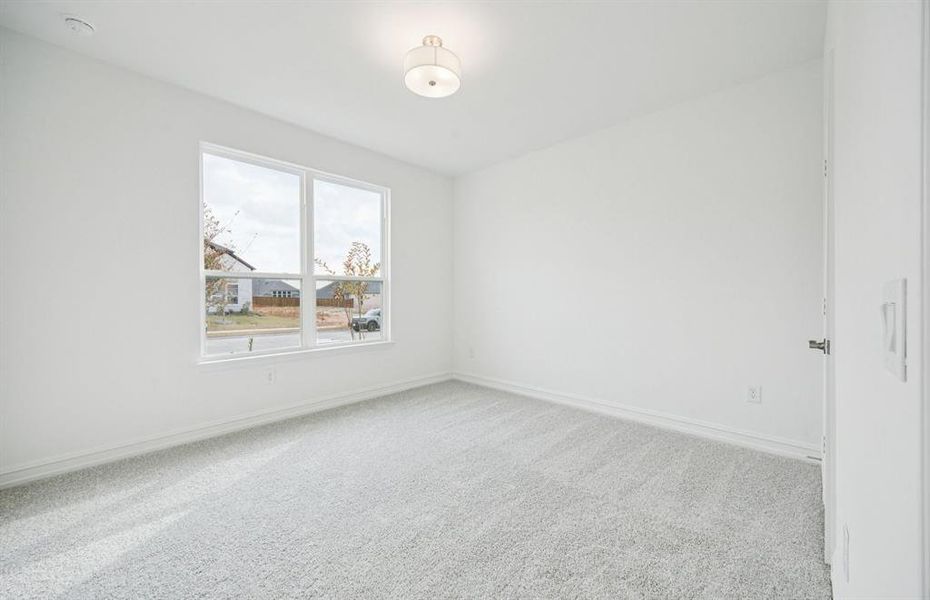 Comfortable bedroom with a bright window view Comfortable bedroom with a bright window view