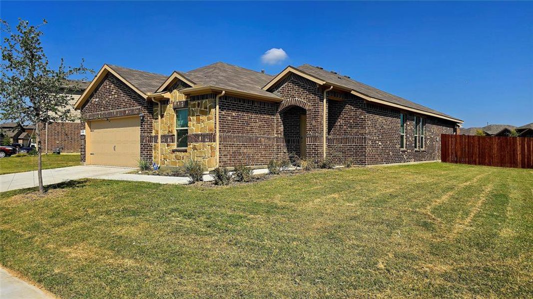 Ranch-style home with brick siding, concrete driveway, and an attached garage Ranch-style home with brick siding, concrete driveway, and an attached garage