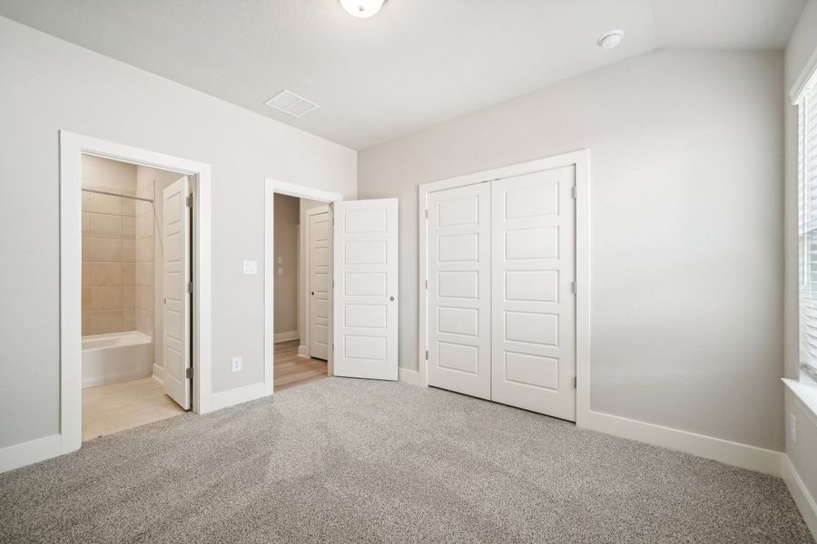 Guest bedroom in the Preston floorplan at a Meritage Homes community.