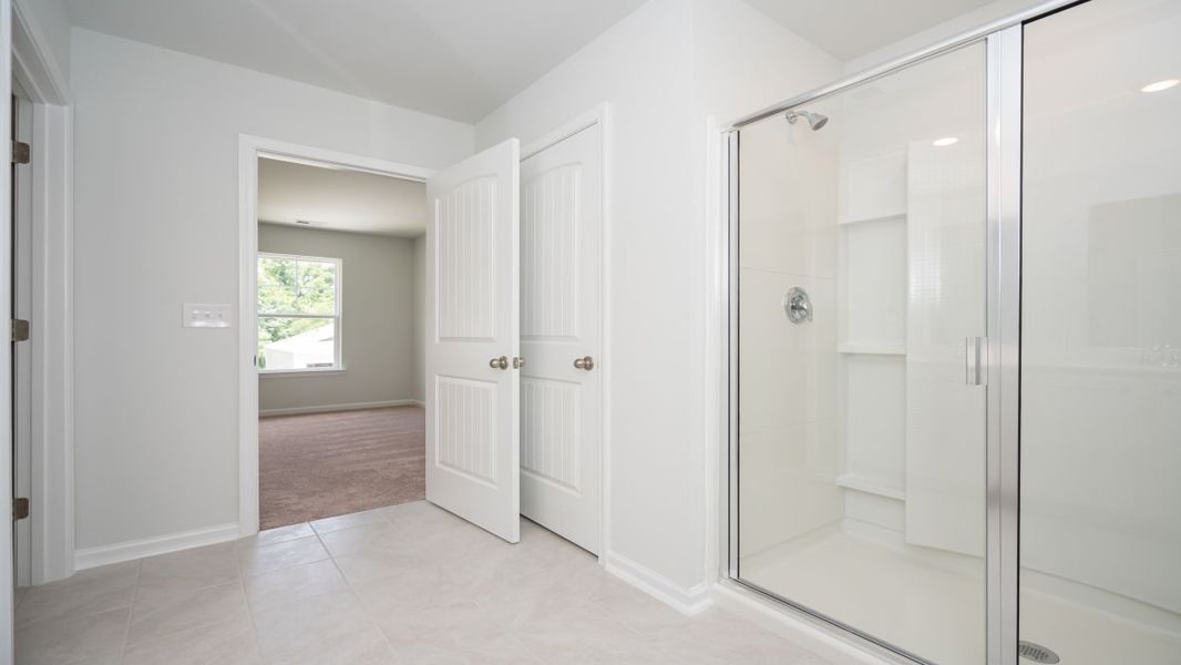 Representative unfurnished interior of a home built from the ROBIE by D.R. Horton in Indigo Preserve, Leland (Image 37).