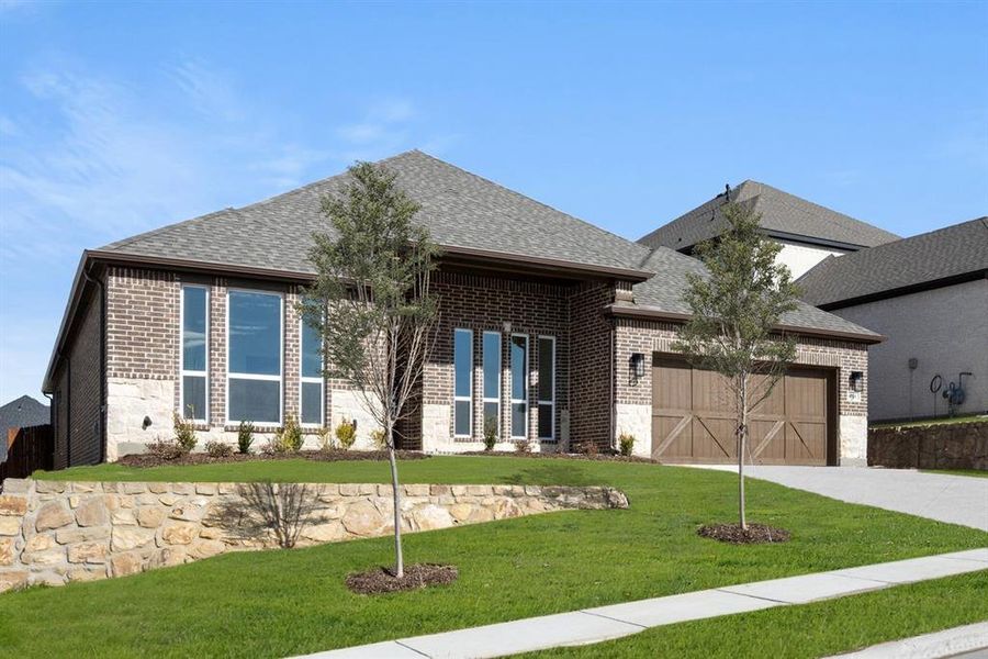 Front exterior of a new home in High Country, Burleson, TX, highlighting curb appeal (Image 2).