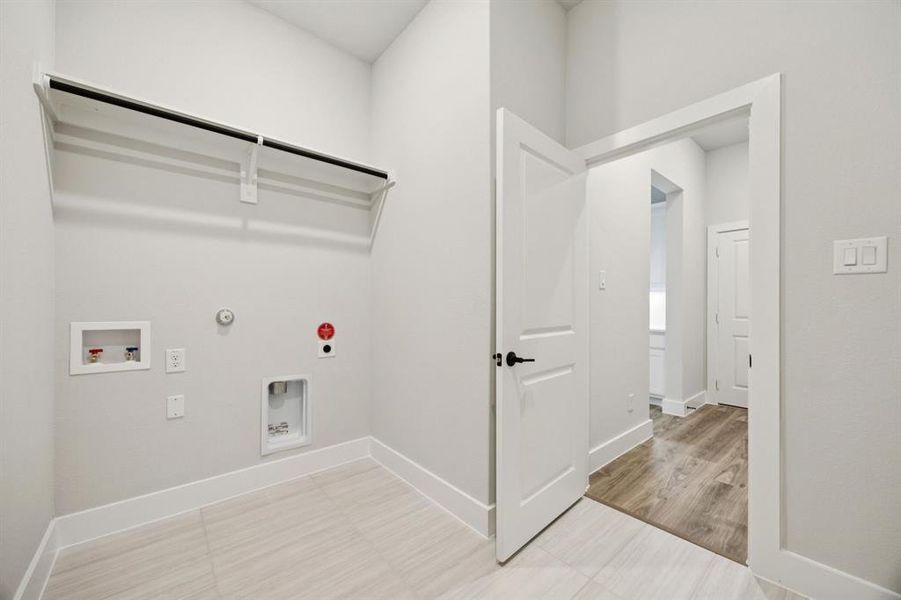 Washroom featuring gas dryer hookup, washer hookup, and electric dryer hookup