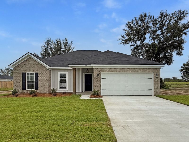 Front exterior of a new home in Tibet Road at Sassafras, Allenhurst, GA, highlighting curb appeal (Image 1).