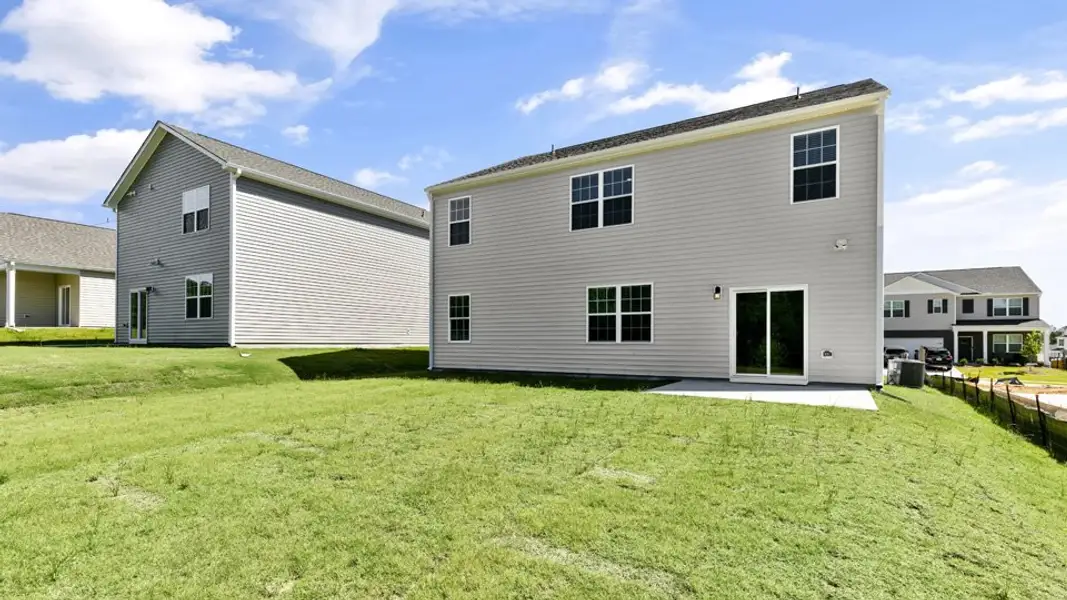 Exterior details and patio area of a home in The Grove at Matthews Landing, Fuquay Varina (Image 3).