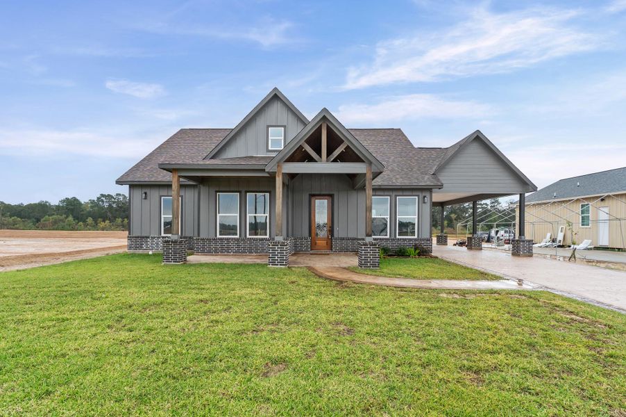 Front exterior of a new home in , Huffman, TX, highlighting curb appeal (Image 23).