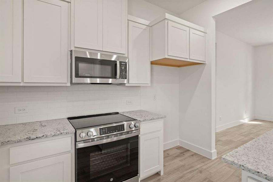 Furnished interior view inside a new home in Saddleback Estates, Boyd (Image 9).