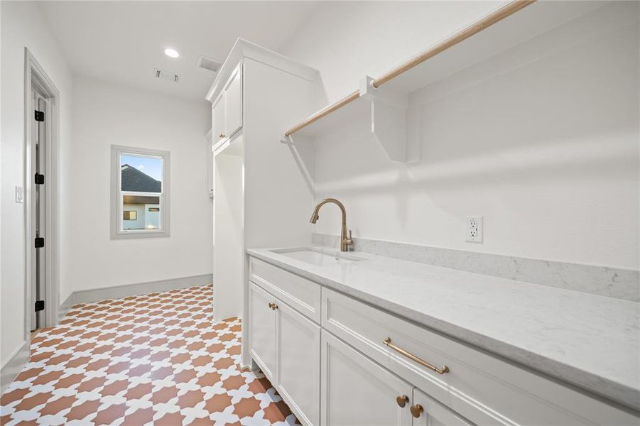 Laundry room featuring light flooring and recessed lighting Laundry room featuring light flooring and recessed lighting