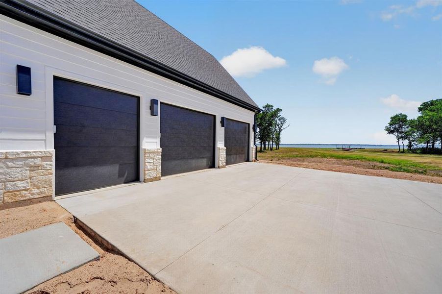 Oversized 2.5 car garage with dedicated golf cart bay. Oversized 2.5 car garage with dedicated golf cart bay.
