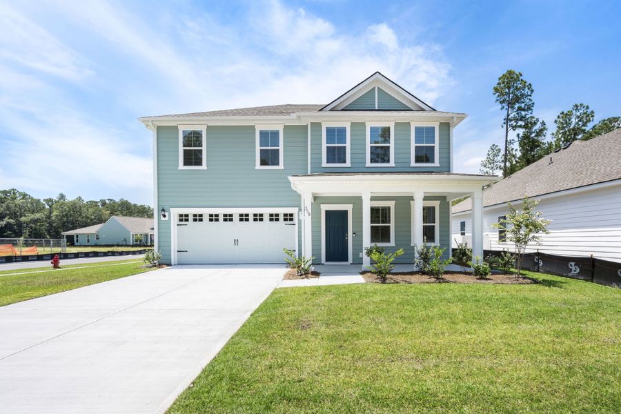 Front exterior of a new home in Waterways, Richmond Hill, GA, highlighting curb appeal (Image 19).