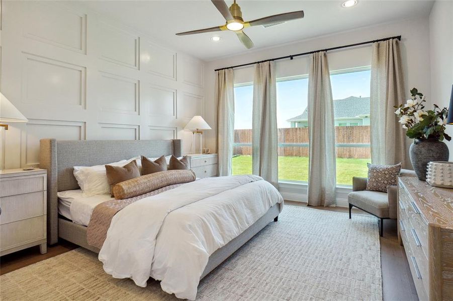 Bedroom featuring ceiling fan and light wood-type flooring