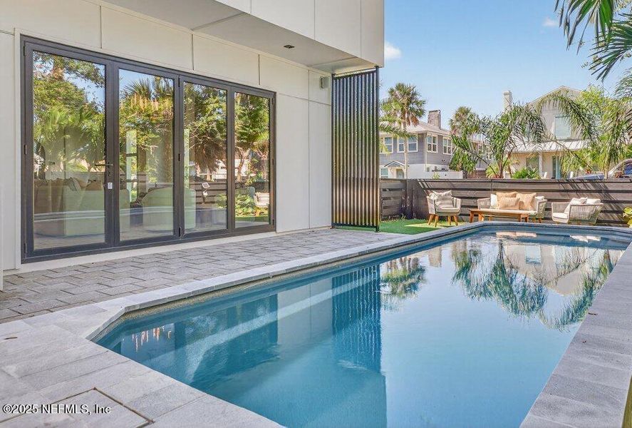 Exterior details and patio area of a home in , Neptune Beach (Image 40).