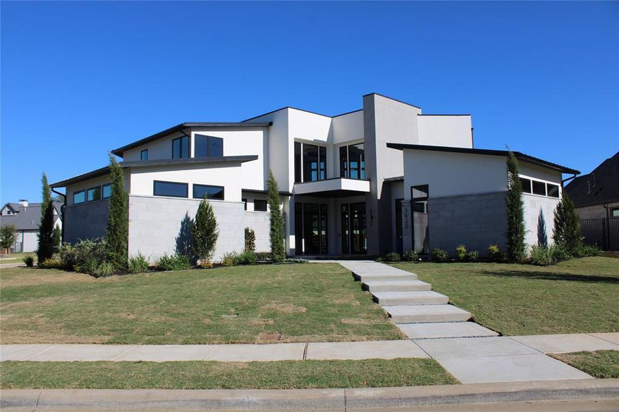 Contemporary home featuring a front yard