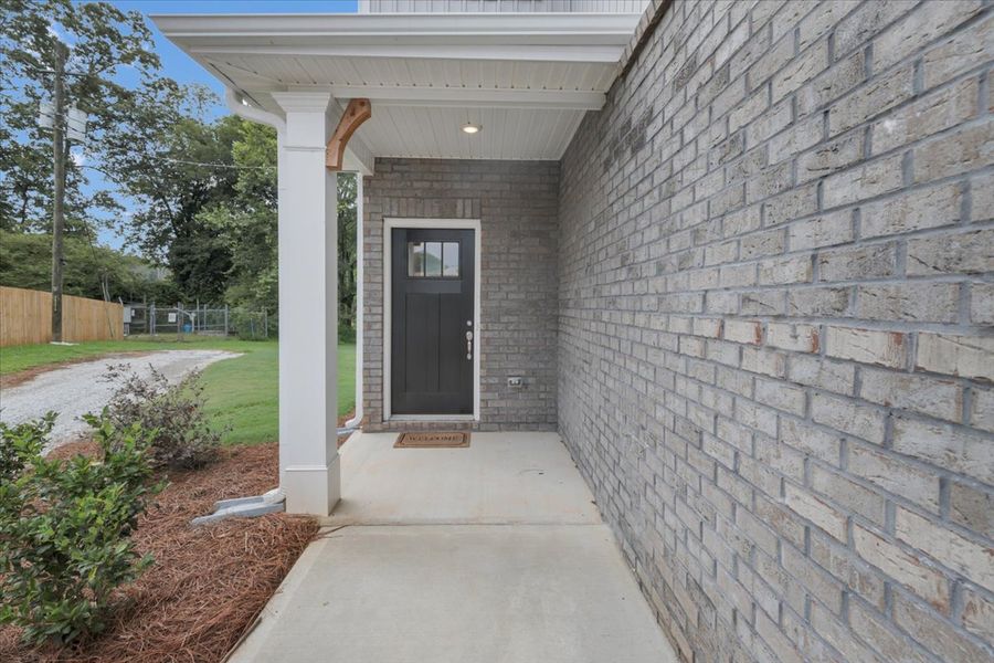 Exterior details and patio area of a home in Scarlett Place, Bowdon (Image 3).