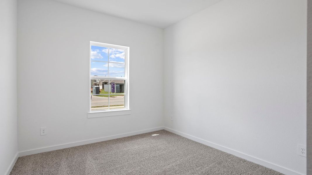 Representative unfurnished interior of a home built from the Mitchell by D.R. Horton in Caldwell Crossing, Iowa Colony (Image 23).