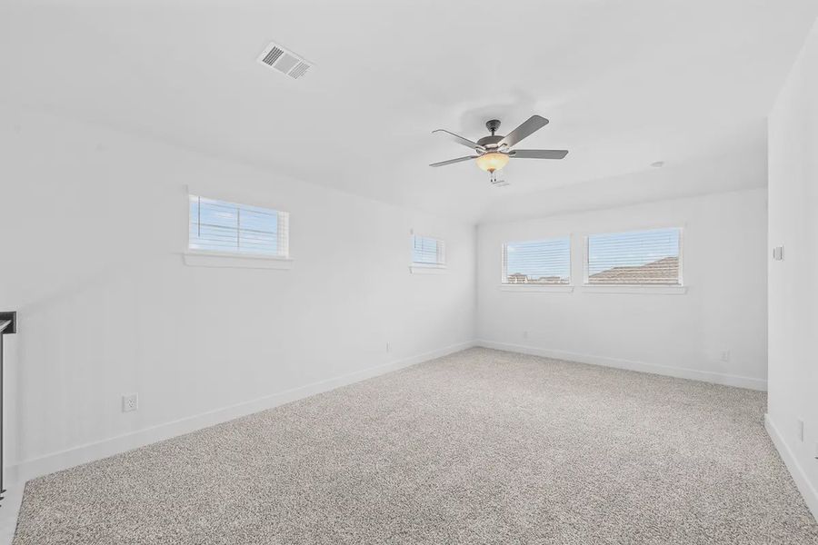 Representative unfurnished interior of a home built from the Madison by Chesmar Homes in Grange, Katy (Image 28).