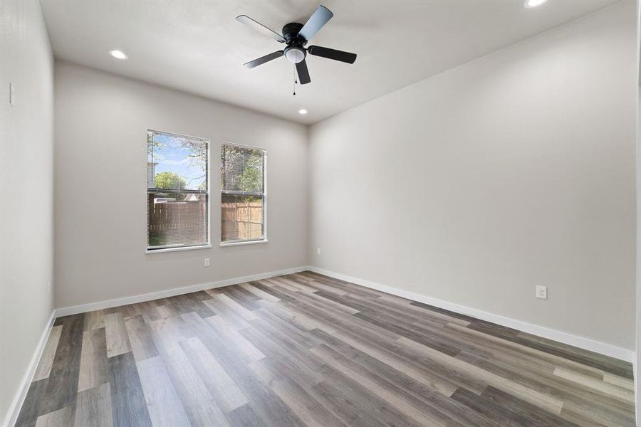 Unfurnished room featuring hardwood / wood-style floors and ceiling fan