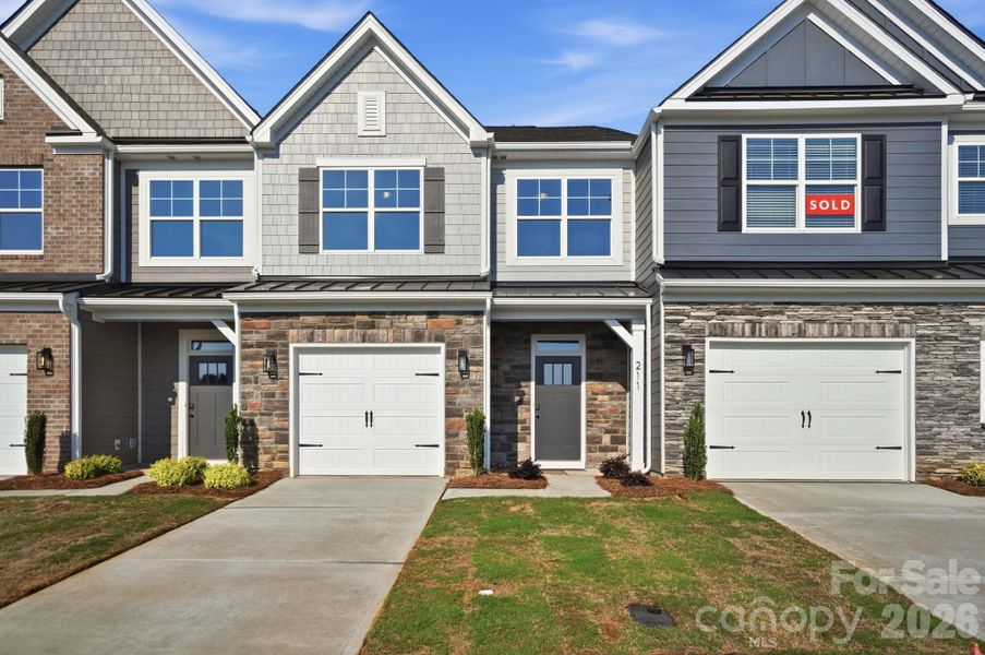 Front exterior of a new home in Blythe Mill Townhomes, Waxhaw, NC, highlighting curb appeal (Image 1). Front exterior of a new home in Blythe Mill Townhomes, Waxhaw, NC, highlighting curb appeal (Image 1).