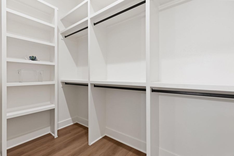 Spacious closet with wood finished floors Spacious closet with wood finished floors