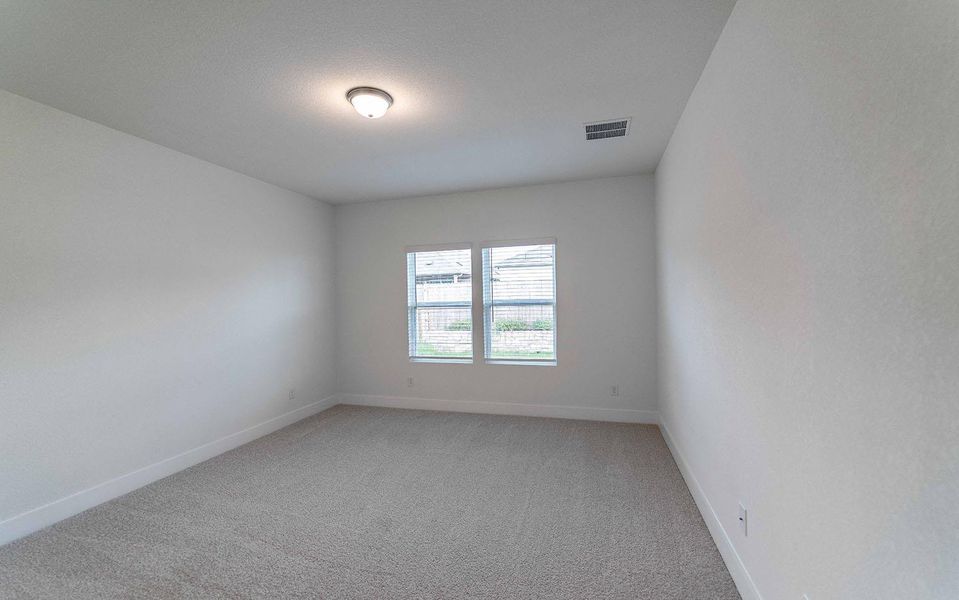 Unfurnished room featuring light carpet and baseboards Unfurnished room featuring light carpet and baseboards