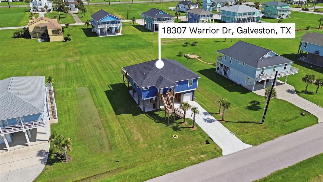Charming elevated home on a spacious lot, featuring a modern design with ample outdoor space and situated in a serene Galveston neighborhood. Charming elevated home on a spacious lot, featuring a modern design with ample outdoor space and situated in a serene Galveston neighborhood.