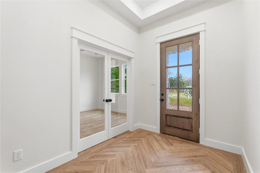 Upon entering, you’ll be greeted by 11 foot ceilings in your foyer, gorgeous wood-look tile flooring and an abundance of natural light.