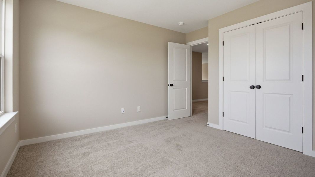 Bedroom with window and closet Bedroom with window and closet