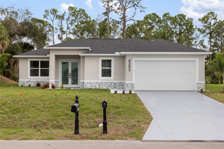 Front exterior of a new home in , North Port, FL, highlighting curb appeal (Image 1). Front exterior of a new home in , North Port, FL, highlighting curb appeal (Image 1).