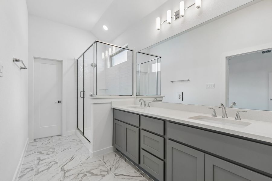 Primary Bathroom in the Claret home plan by Trophy Signature Homes – REPRESENTATIVE PHOTO