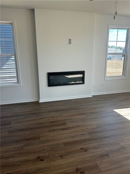 This inviting space features elegant flooring and