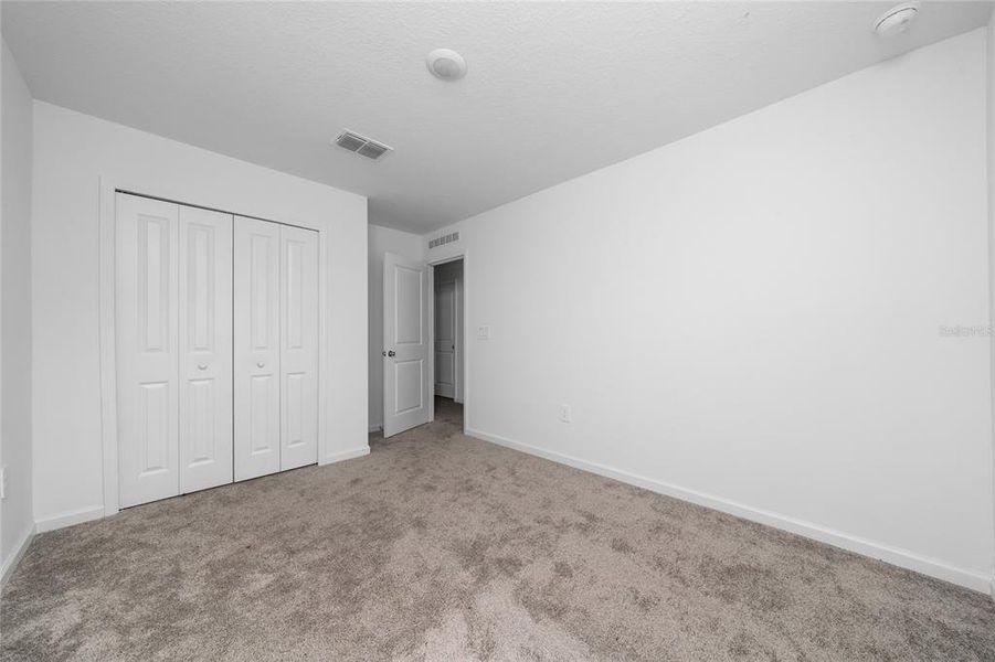 Spacious, unfurnished interior of a new home in Ranches at Lake Mcleod: Legacy Collection, Eagle Lake (Image 13).