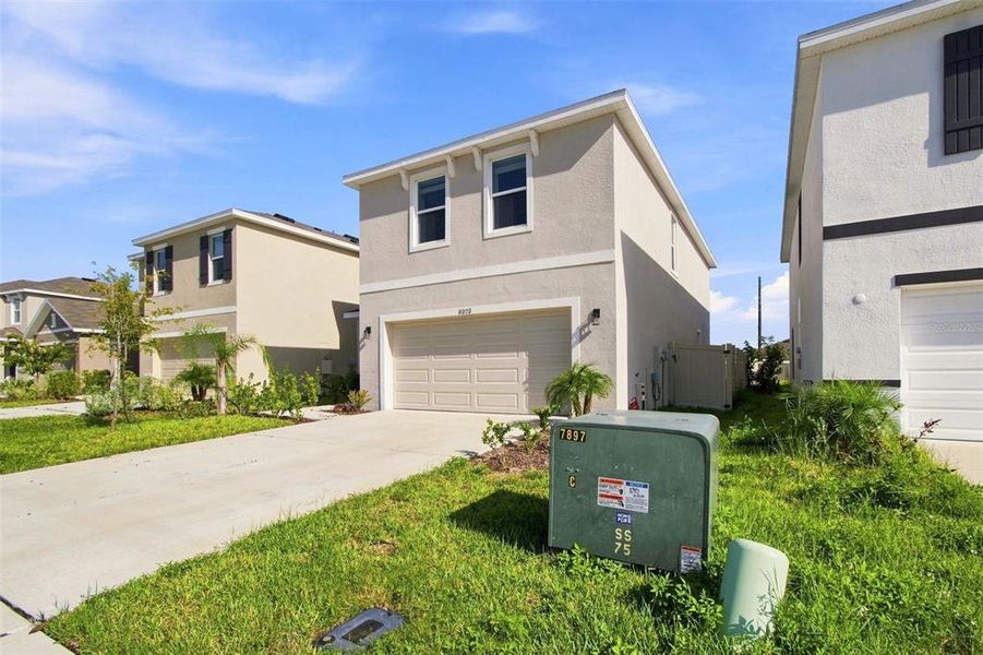Front exterior of a new home in , Wesley Chapel, FL, highlighting curb appeal (Image 23).
