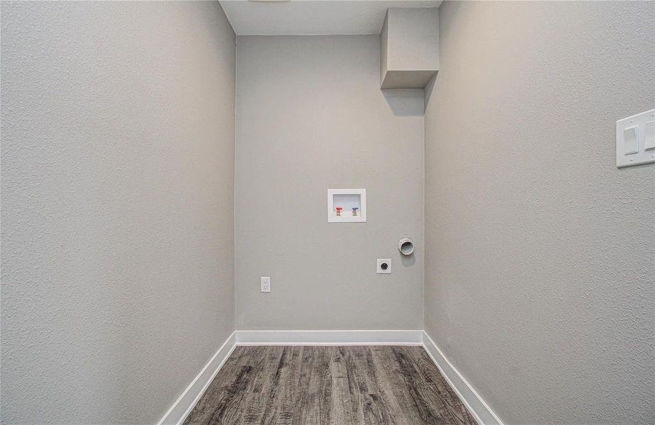 Dedicated laundry space with washer and dryer connections ready for move-in day.
