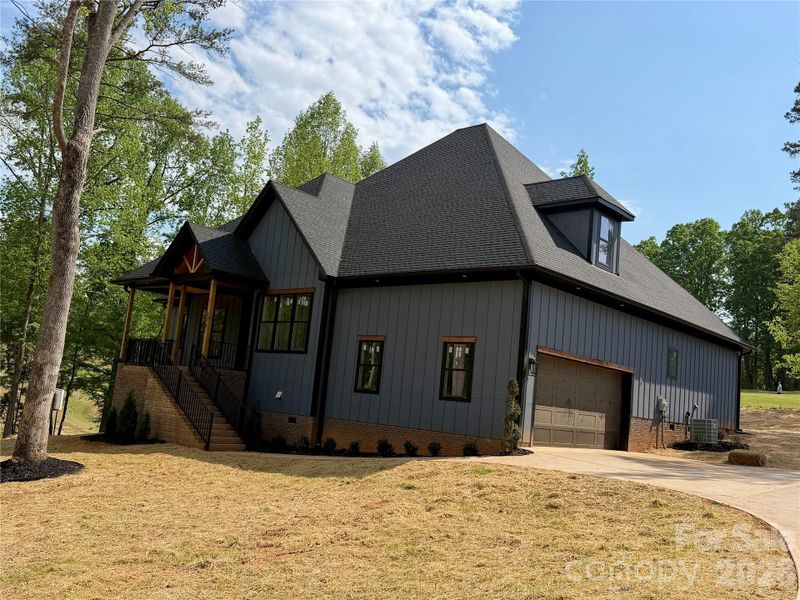 Front exterior of a new home in , Statesville, NC, highlighting curb appeal (Image 1). Front exterior of a new home in , Statesville, NC, highlighting curb appeal (Image 1).