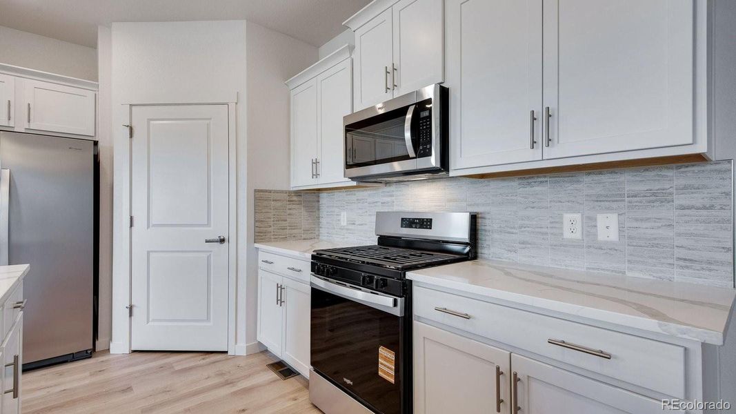 Furnished interior view inside a new home in Trails at Crowfoot, Parker (Image 6).