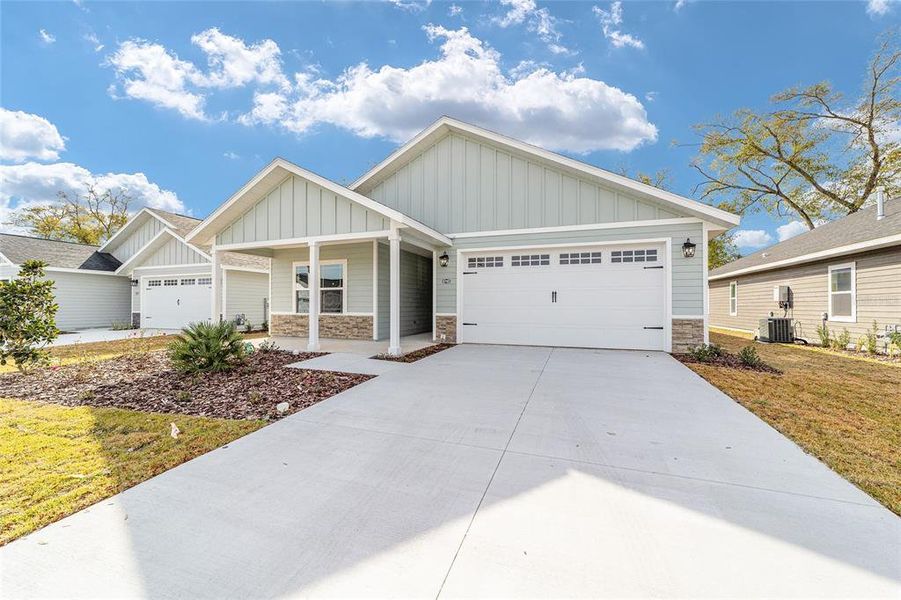 Front exterior of a new home in Grand Oaks, Gainesville, FL, highlighting curb appeal (Image 23). Front exterior of a new home in Grand Oaks, Gainesville, FL, highlighting curb appeal (Image 23).