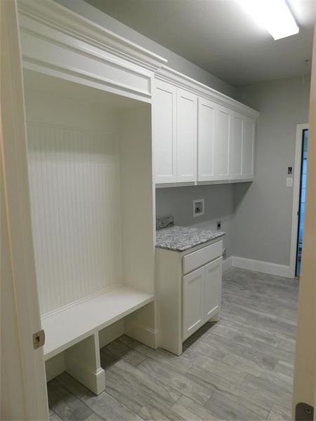 Mudroom featuring light wood-type flooring