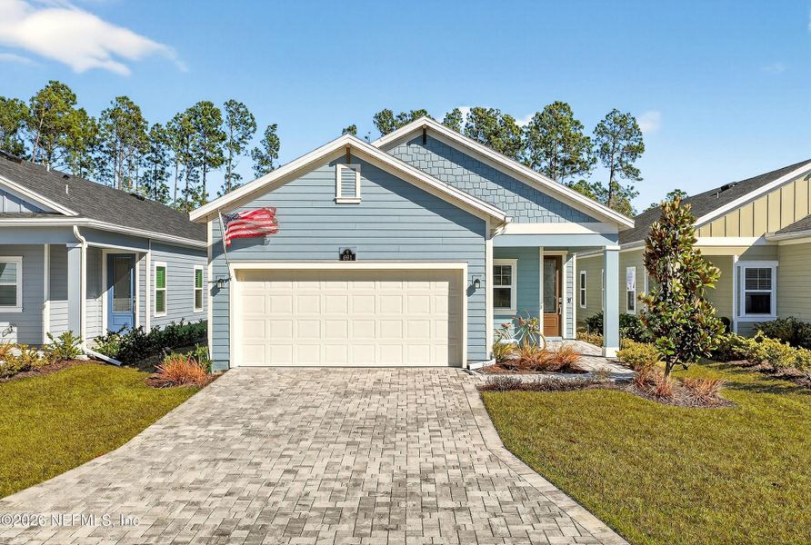 Front exterior of a new home in , St. Johns, FL, highlighting curb appeal (Image 22). Front exterior of a new home in , St. Johns, FL, highlighting curb appeal (Image 22).