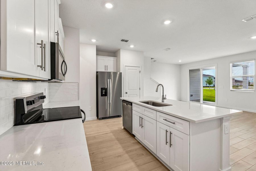 Furnished interior view inside a new home in The District at Oakleaf - The Grove, Middleburg (Image 9).