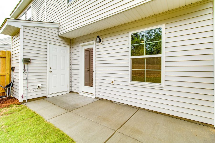 Exterior details and patio area of a home in Padgett Commons, Hopkins (Image 3).