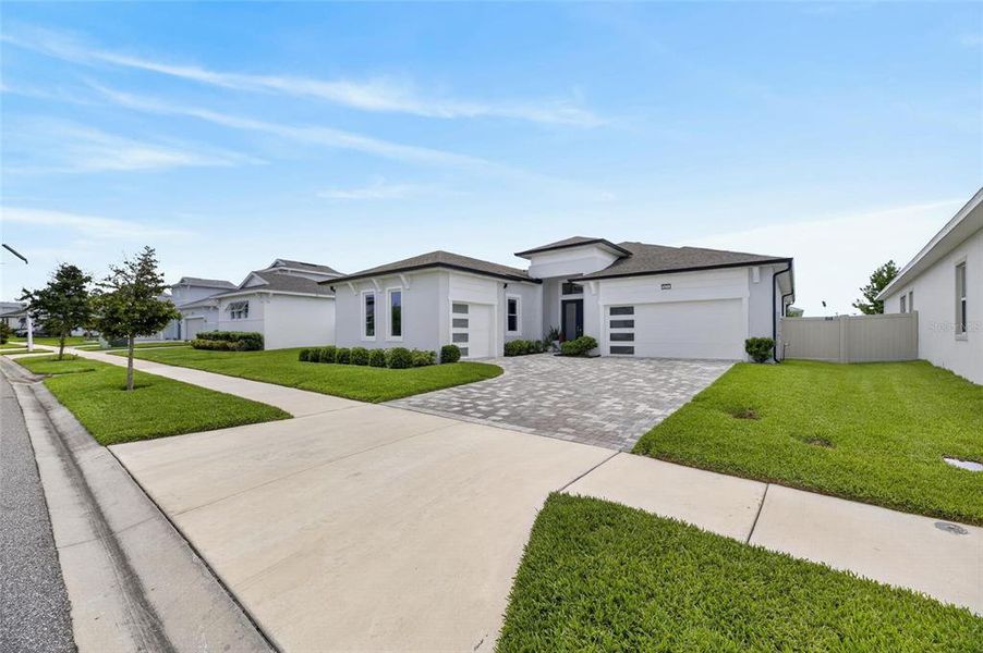 Front exterior of a new home in Robin's Cove at Epperson, Wesley Chapel, FL, highlighting curb appeal (Image 25).