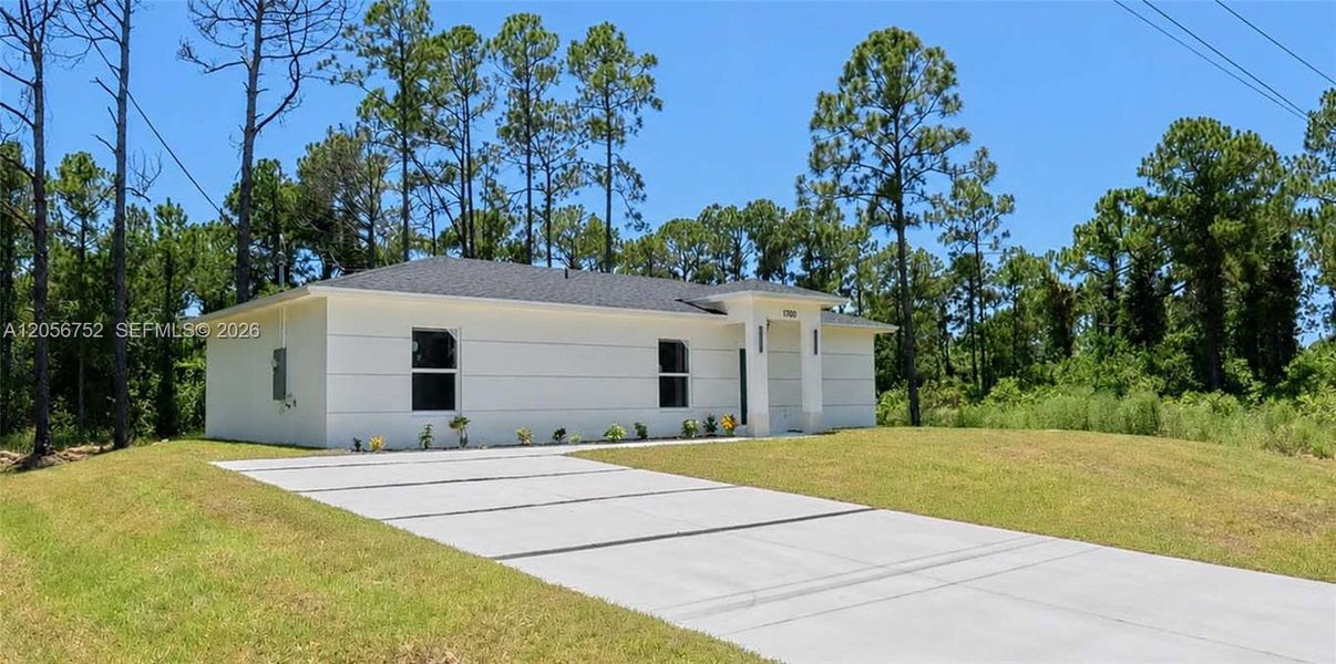 Front exterior of a new home in , Lehigh Acres, FL, highlighting curb appeal (Image 1). Front exterior of a new home in , Lehigh Acres, FL, highlighting curb appeal (Image 1).