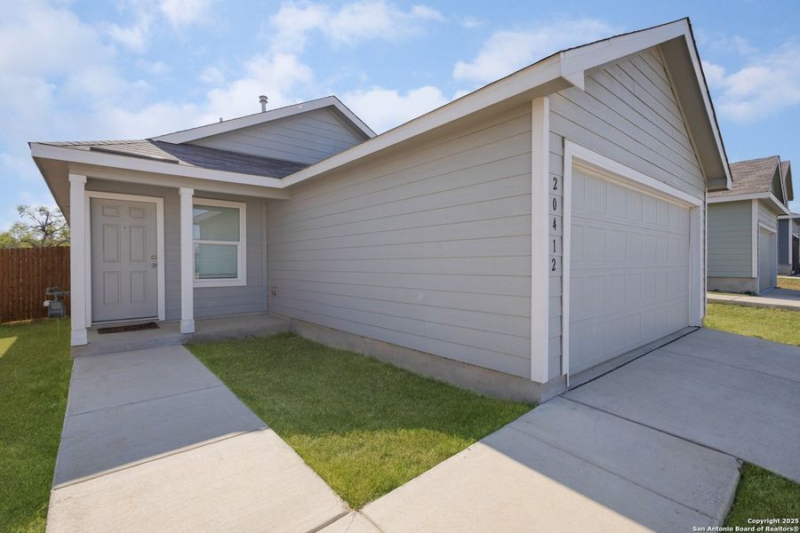 Exterior details and patio area of a home in Ruby Crossing: Cottage Collection, San Antonio (Image 15).