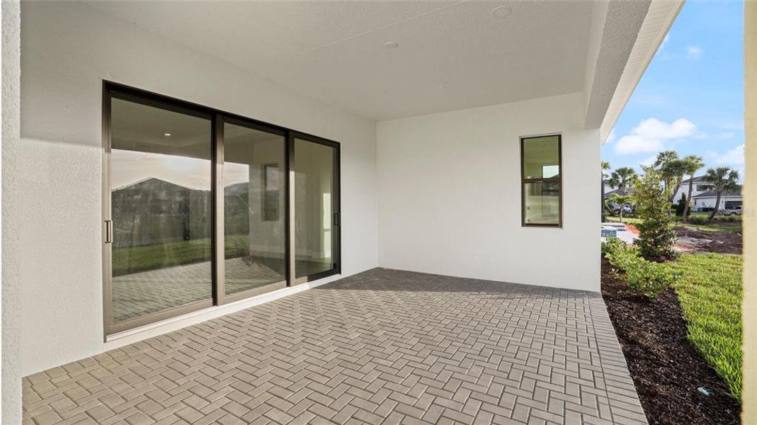 Exterior details and patio area of a home in Cresswind Lakewood Ranch, Lakewood Ranch (Image 3).