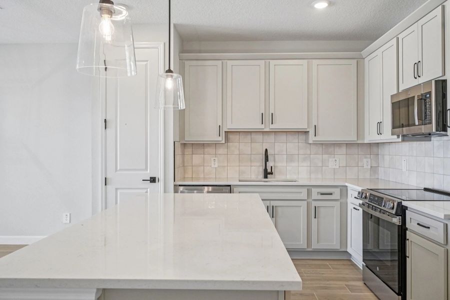 Foyer leads into stunning designer kitchen featuring AW Collection® Artisan